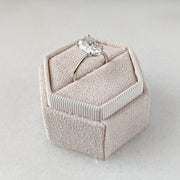 Oval cut lab grown diamond solitaire engagement ring in prong setting on polished gold band