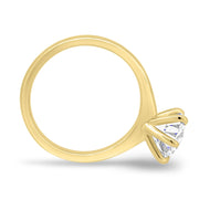 Round cut lab grown diamond solitaire engagement ring in classic prong setting on polished gold band