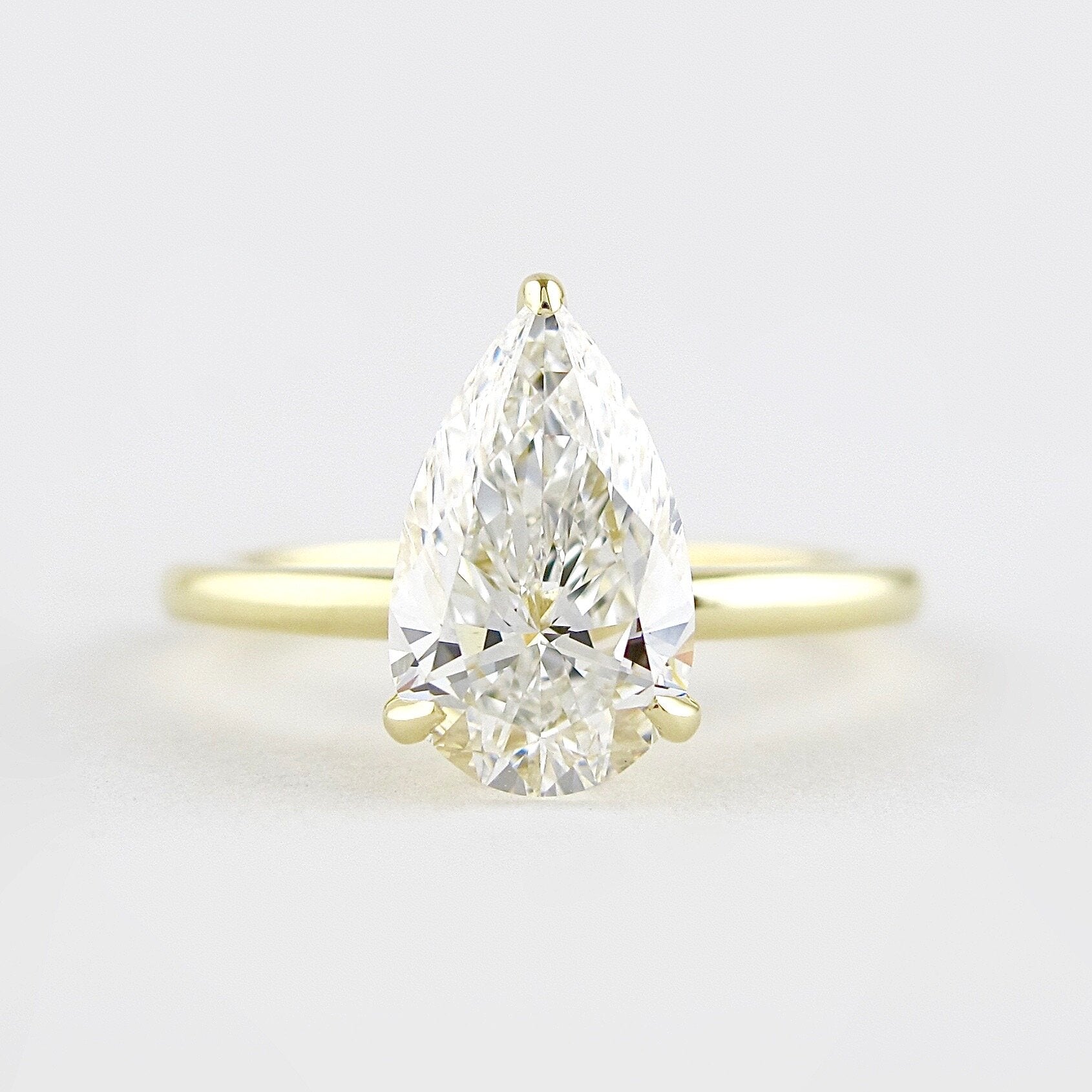 1.5 CT Pear Cut Solitaire Style Moissanite Engagement Ring - Barbara Maison 