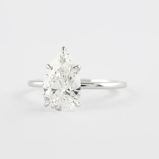 1.5 CT Pear Cut Solitaire Style Moissanite Engagement Ring - Barbara Maison 