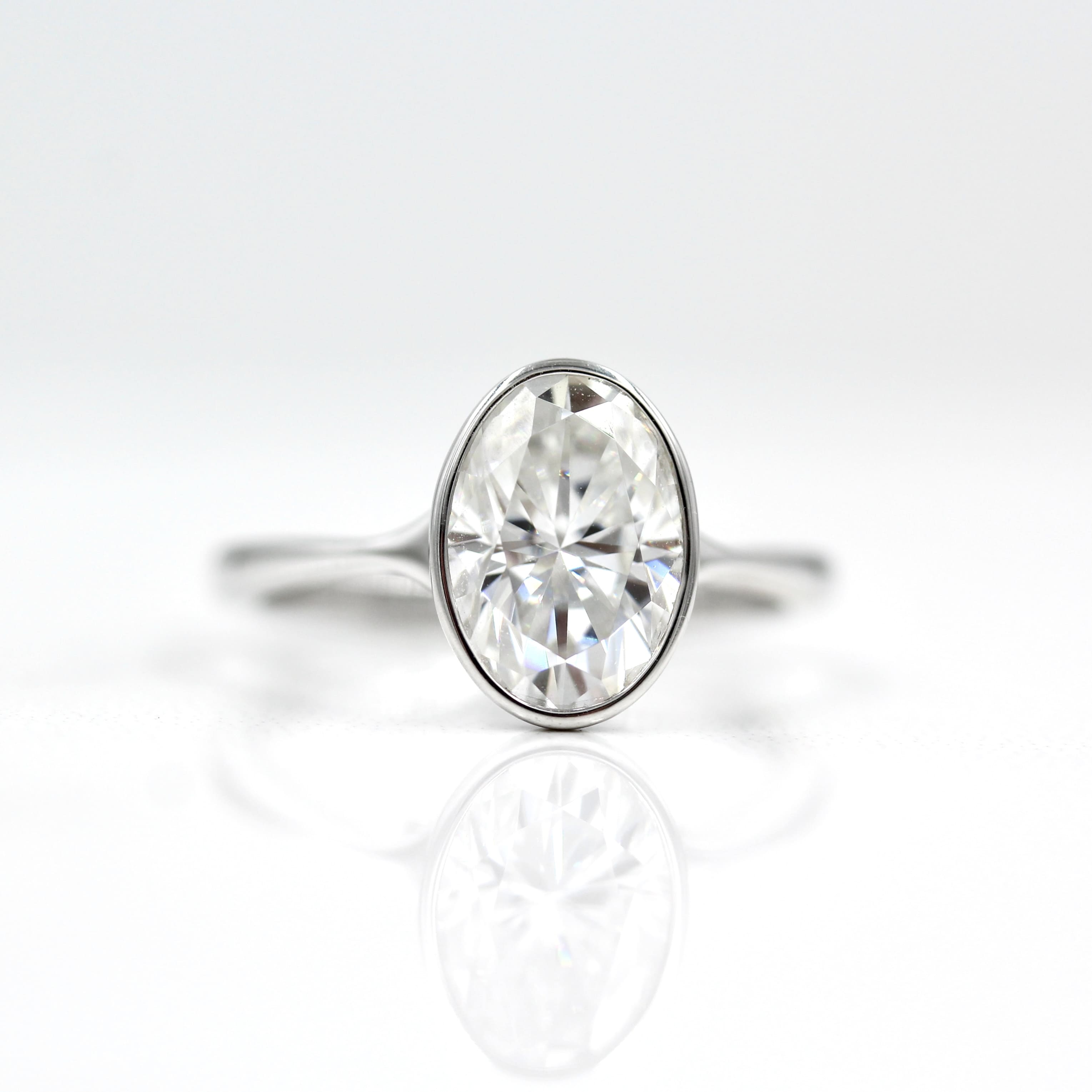 2.0 CT-3.75 CT Oval Bezel Solitaire Moissanite Engagement Ring - Barbara Maison 
