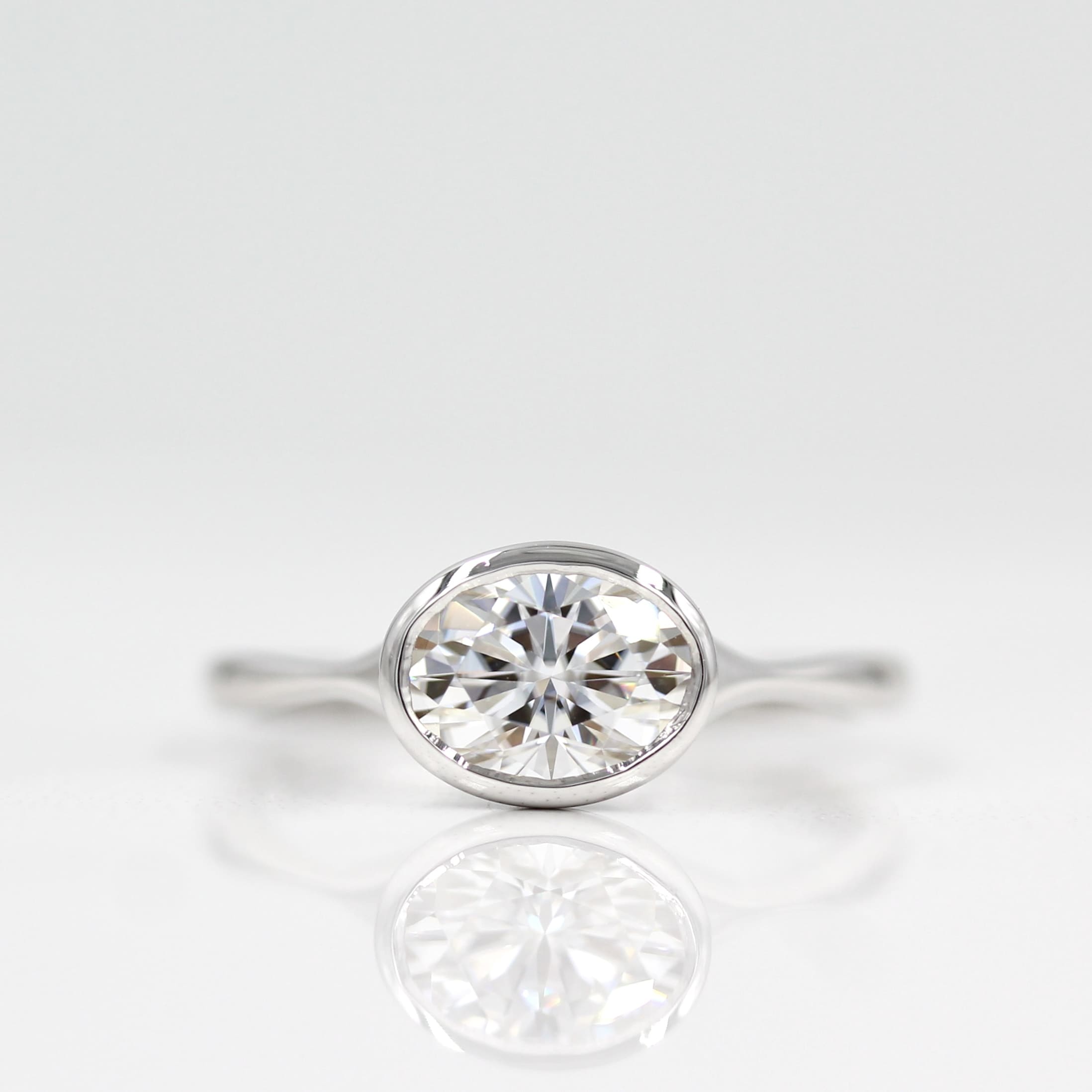 1.0 CT Oval Cut Bezel Solitaire Moissanite Engagement Ring - Barbara Maison 