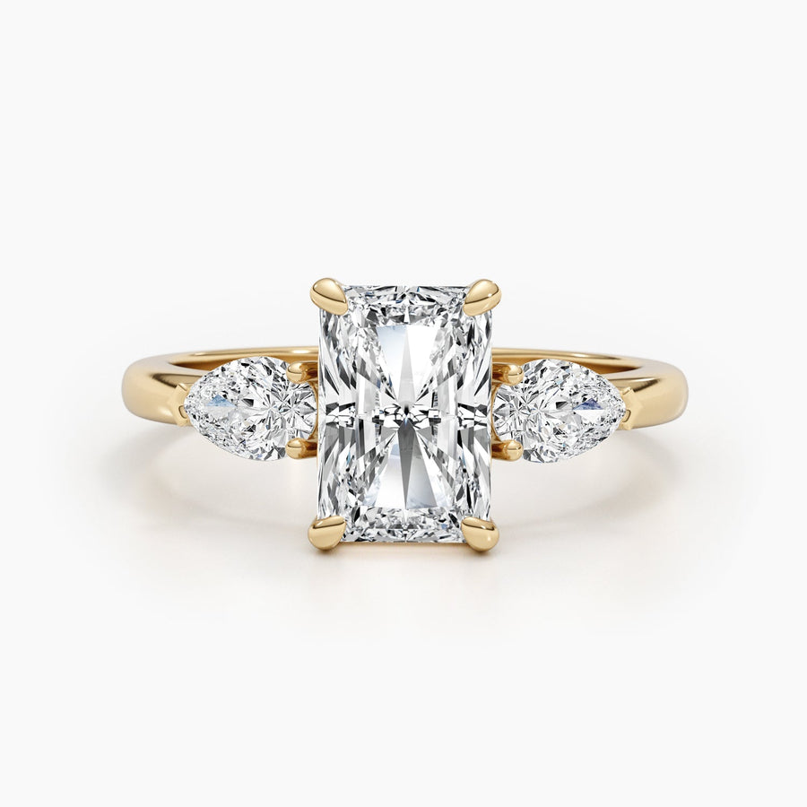 Three stone radiant cut lab grown diamond engagement ring with prong settings on polished gold band, showcasing elegant sparkle