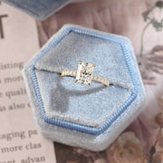 Radiant cut lab grown diamond hidden halo pavé engagement ring with side stones, set in polished gold band