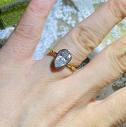 Lab grown diamond engagement ring with pear cut stone in a bezel twisted setting. A unique design that blends modern artistry with timeless romance.