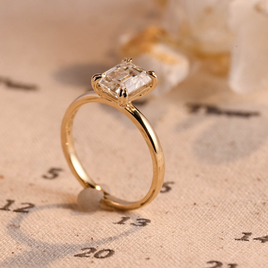 Emerald cut lab grown diamond solitaire engagement ring, 1.0 to 3.0 carats, set in classic prong setting on polished gold band