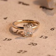 Emerald cut lab grown diamond solitaire engagement ring, 1.0 to 3.0 carats, set in classic prong setting on polished gold band