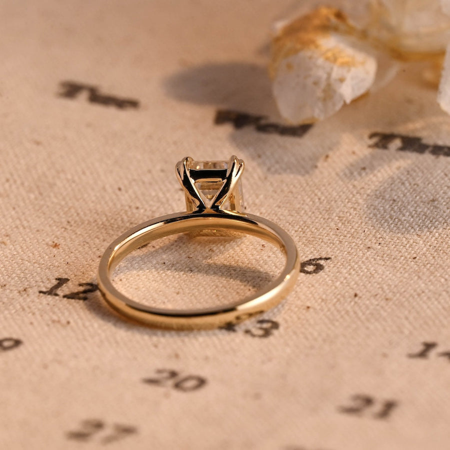 Emerald cut lab grown diamond solitaire engagement ring, 1.0 to 3.0 carats, set in classic prong setting on polished gold band