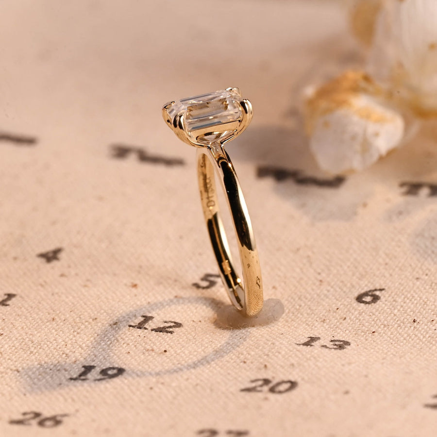 Emerald cut lab grown diamond solitaire engagement ring, 1.0 to 3.0 carats, set in classic prong setting on polished gold band