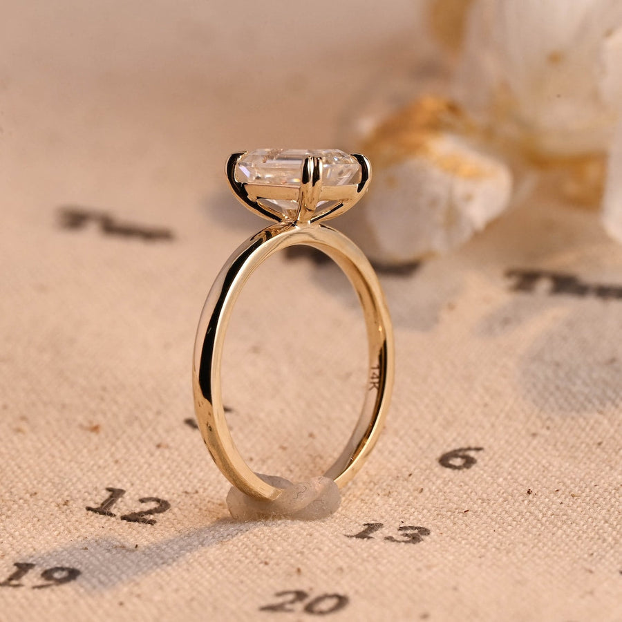 Emerald cut lab grown diamond solitaire engagement ring, 1.0 to 3.0 carats, set in classic prong setting on polished gold band