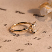 Emerald cut lab grown diamond solitaire engagement ring, 1.0 to 3.0 carats, set in classic prong setting on polished gold band