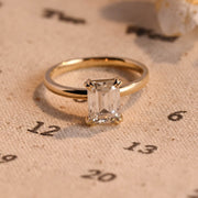Emerald cut lab grown diamond solitaire engagement ring, 1.0 to 3.0 carats, set in classic prong setting on polished gold band