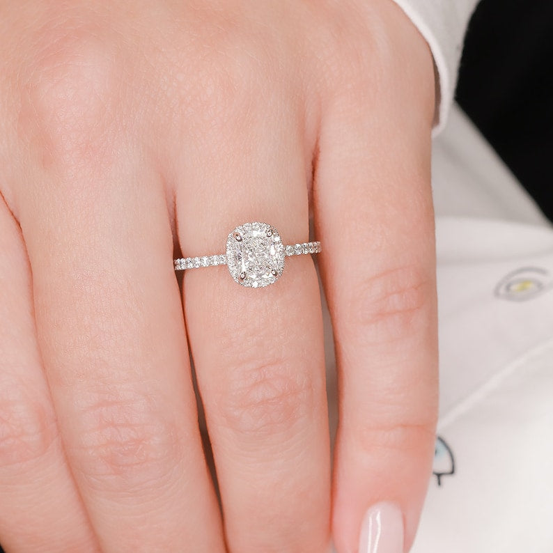 Cushion cut lab grown diamond halo engagement ring with pavé setting and polished gold band