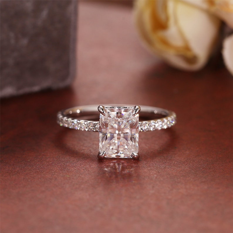 Radiant cut lab grown diamond engagement ring with pavé setting and polished gold band