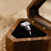 Radiant cut lab grown diamond three stone engagement ring with side stones in elegant prong setting on polished gold band