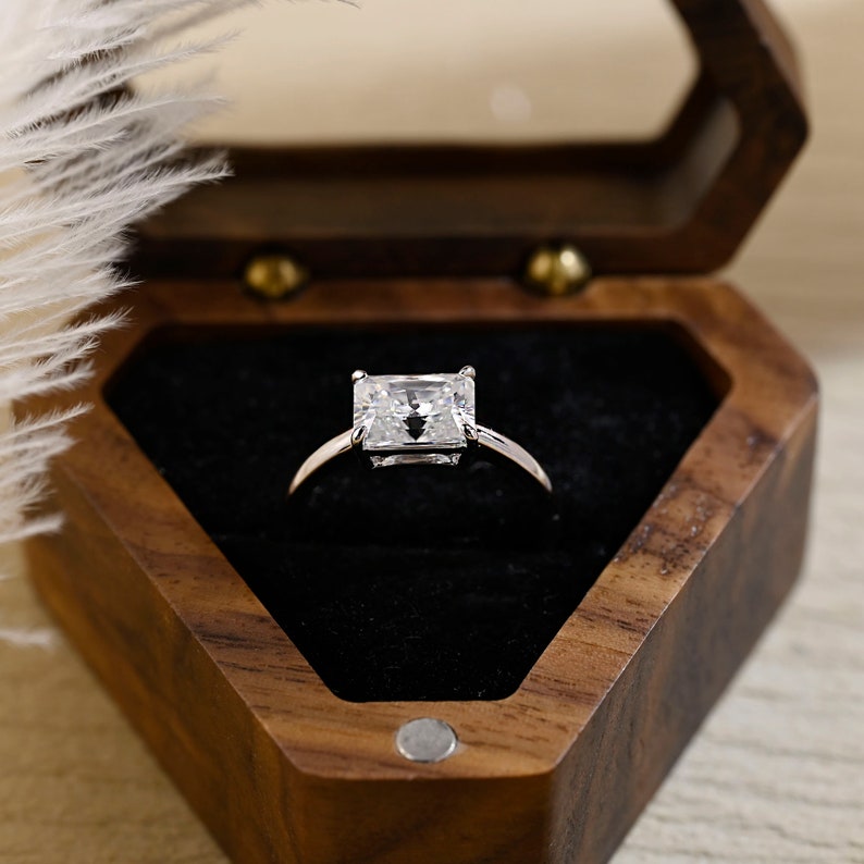 Radiant cut lab grown diamond solitaire engagement ring set in a classic prong setting on a polished gold band