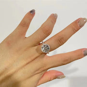 Round cut lab grown diamond halo pavé engagement ring with side stones set in polished gold band