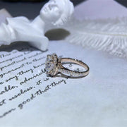 Round cut lab grown diamond halo pavé engagement ring with side stones set in polished gold band