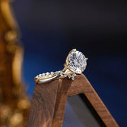 Round cut lab grown diamond unique engagement ring in a contemporary setting with elegant design on polished gold band