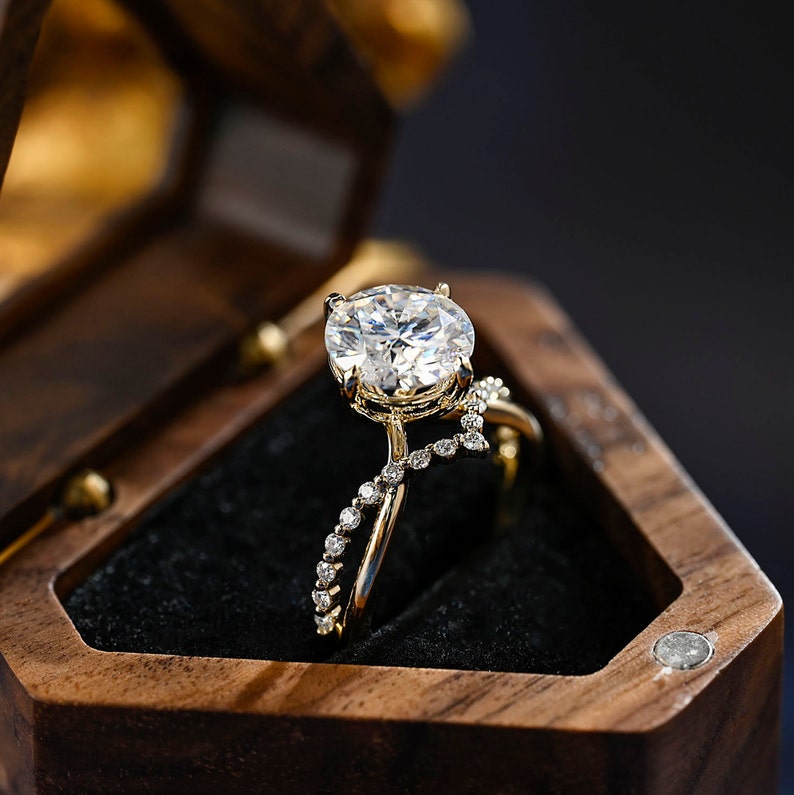 Round cut lab grown diamond unique engagement ring in a contemporary setting with elegant design on polished gold band