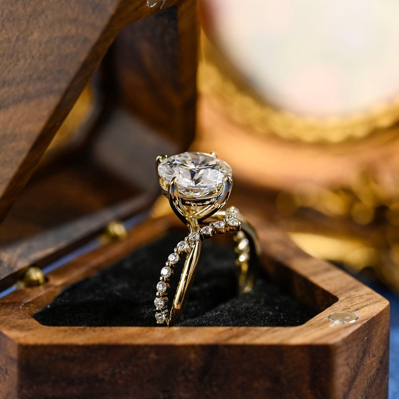 Round cut lab grown diamond unique engagement ring in a contemporary setting with elegant design on polished gold band