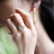 Round cut lab grown diamond unique engagement ring in a contemporary setting with elegant design on polished gold band