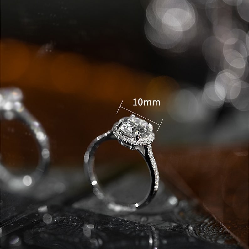 Round cut lab grown diamond halo pavé engagement ring with side stones set in polished gold band
