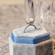 Oval cut lab grown diamond halo pavé engagement ring with side stones, set in prong design on polished gold band