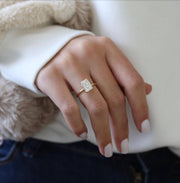 Emerald cut lab grown diamond engagement ring with hidden halo setting, crafted in polished gold for a refined and elegant look