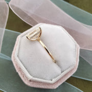 Emerald cut lab grown diamond engagement ring with hidden halo setting, crafted in polished gold for a refined and elegant look