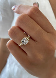 Round cut lab grown diamond dainty style engagement ring with delicate band in polished gold setting