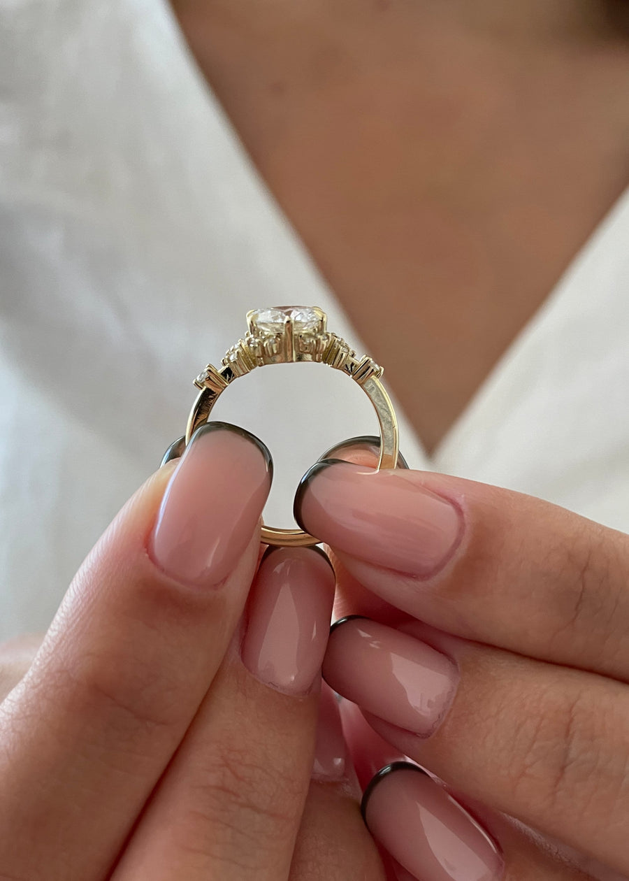 Round cut lab grown diamond dainty style engagement ring with delicate band in polished gold setting