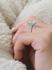 Radiant cut lab grown diamond engagement ring with hidden halo setting on polished gold band, creating extra sparkle and elegance