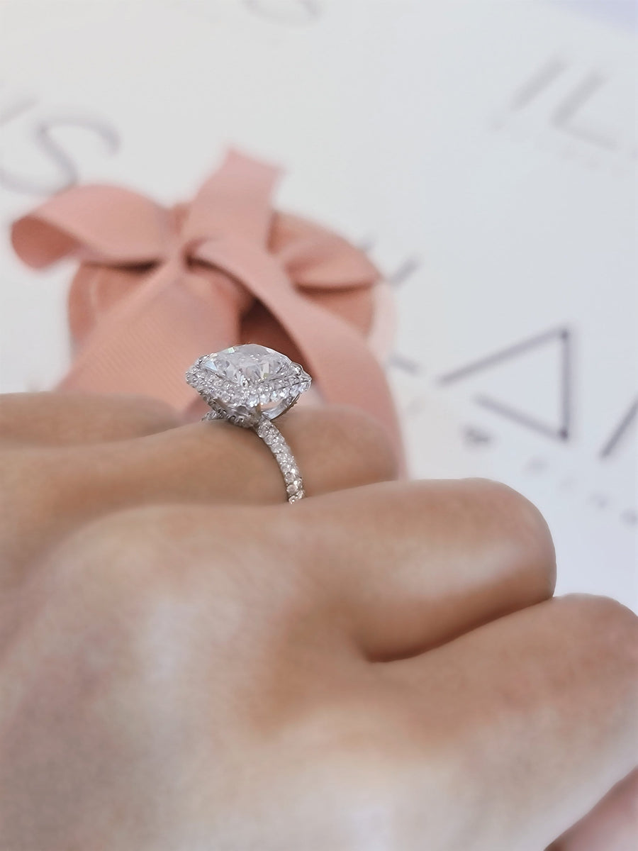 Cushion cut lab grown diamond double halo engagement ring with pavé accents set in polished gold band