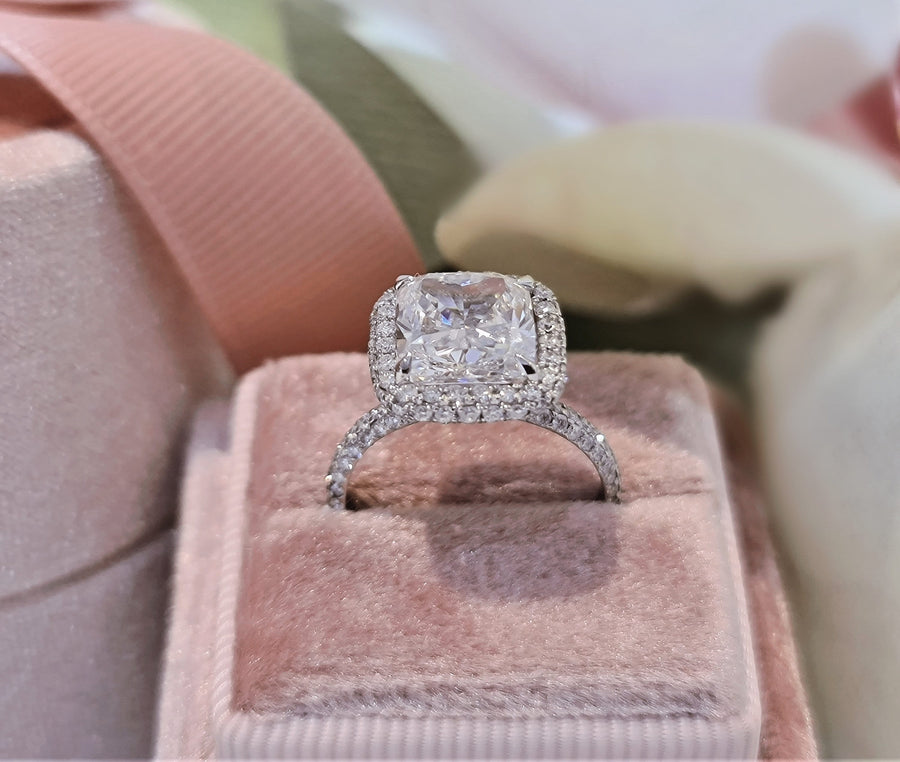 Cushion cut lab grown diamond double halo engagement ring with pavé accents set in polished gold band