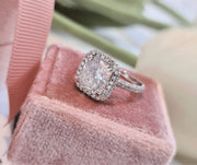 Cushion cut lab grown diamond double halo engagement ring with pavé accents set in polished gold band